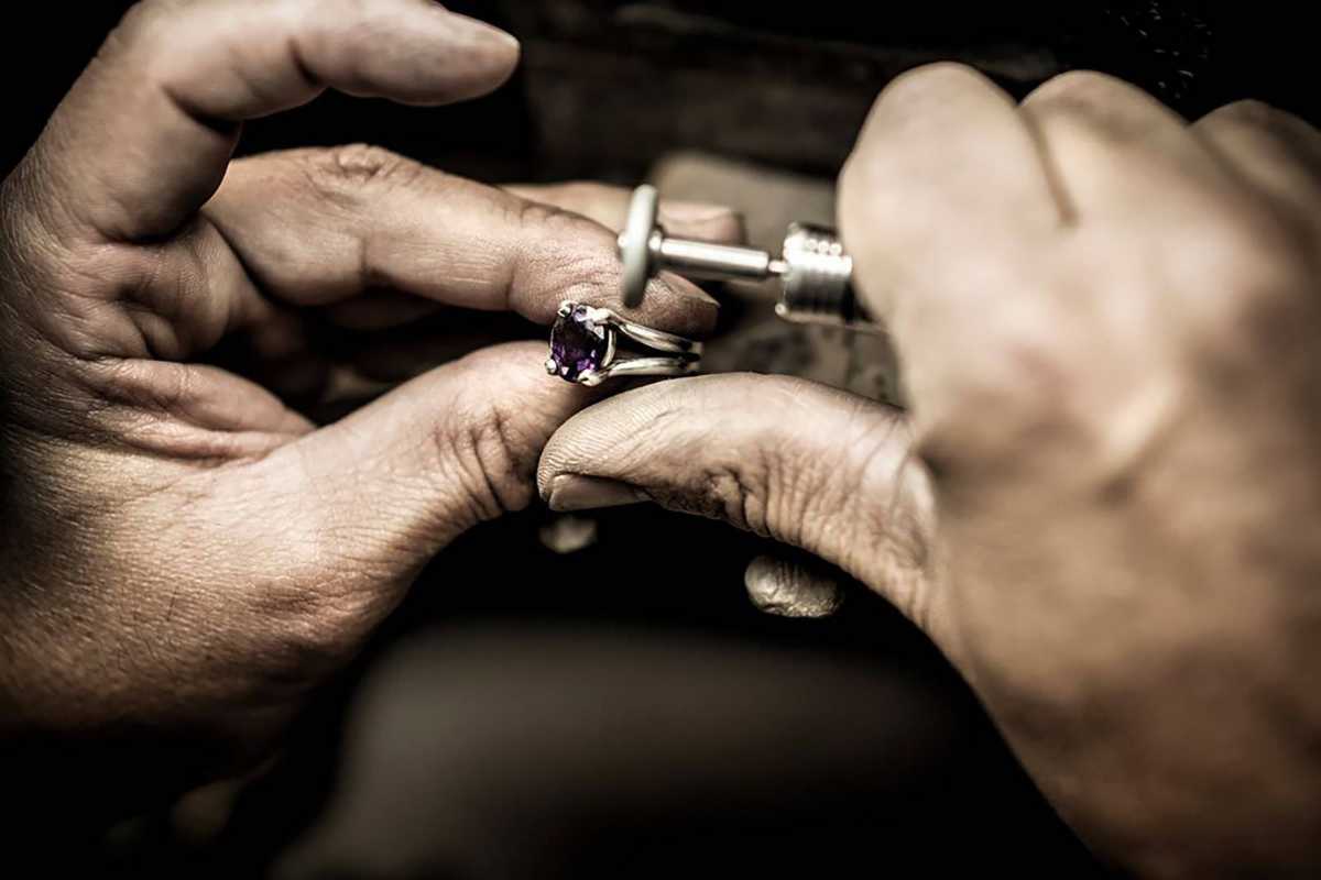 A goldsmith at the bench inside the Saunders & Pughe Hill Street workshop